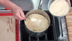 How to make Easy Arancini Recipe Adding Cheese to the hot rice