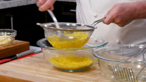 Best Deviled Eggs Recipe - push the egg yolks through the strainer